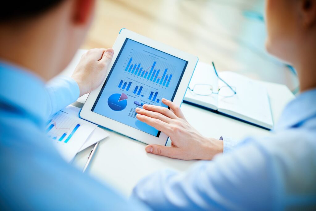 executives-checking-diagrams-with-touchpad-1536x1025