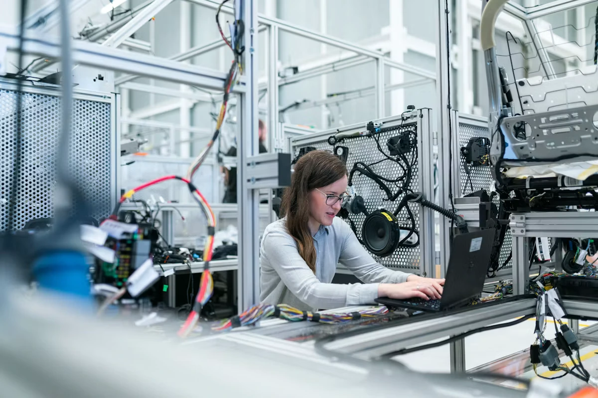 Engineers reviewing plans on a manufacturing floor